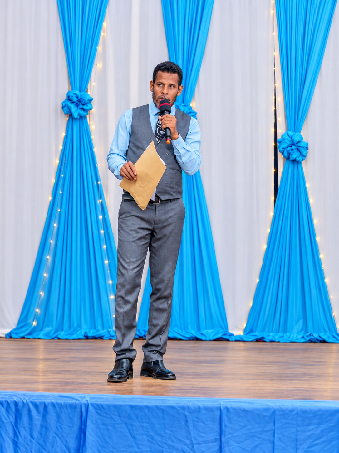 School staff member speaking at an event