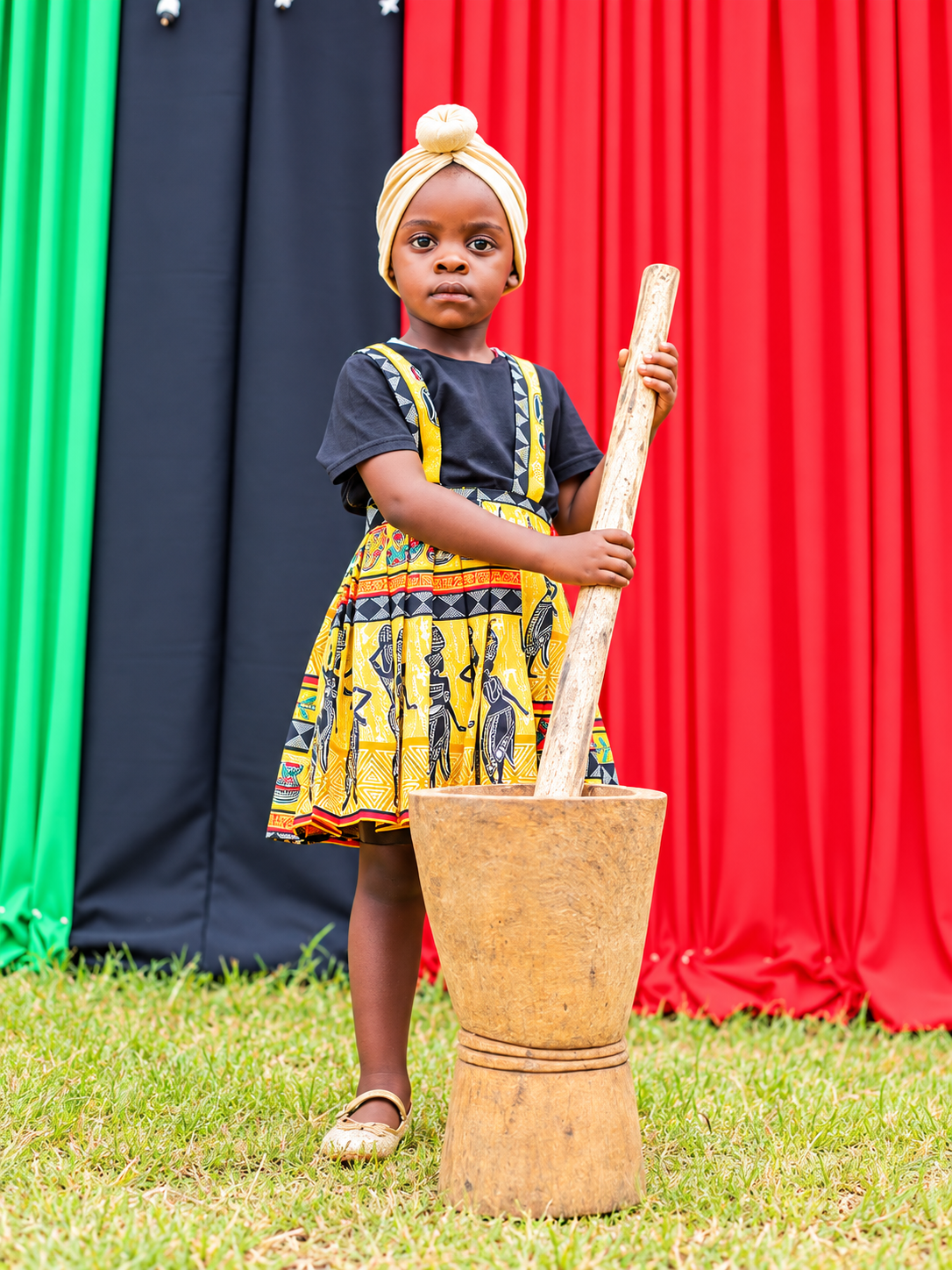 Young kindergarten learner in traditional attire