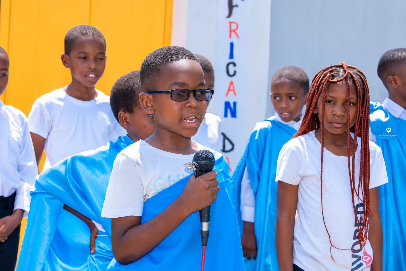 Learner speaking with a microphone